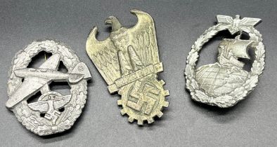 Three assorted reproduction German WW2 badges.