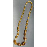Vintage Cut glass amber coloured bead necklace, fitted with a gold clasp.