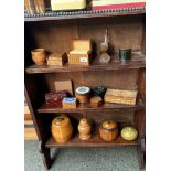 Three shelves of collectable treen ware to include tea and biscuit barrels, trinket boxes and