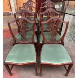 A Set of 6 shield back dining chairs with two matching carvers.