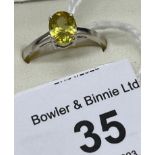 10ct white gold ladies ring set with a yellow glass cut stone. [Ring size P] [1.93grams]