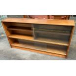 Mid Century teak bookcase produced by Herbert & Gibb , Has glass sliding doors.