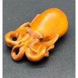 Japanese hand carved boxwood netsuke sculpture of an Octopus. Signed.