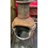 Garden Chiminea with metal stand.