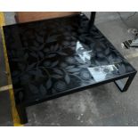 Contemporary black glass and flower design coffee table, metal base.
