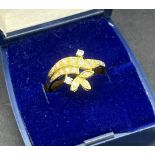 18t yellow gold and diamond ring. Set with 19 various sized diamonds. [Ring size P] [3.95grams] [