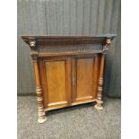 19th Century Gothic 2 Door cupboard, detailing lion faced panels and ornate trims. [100x96.5x39.5cm]