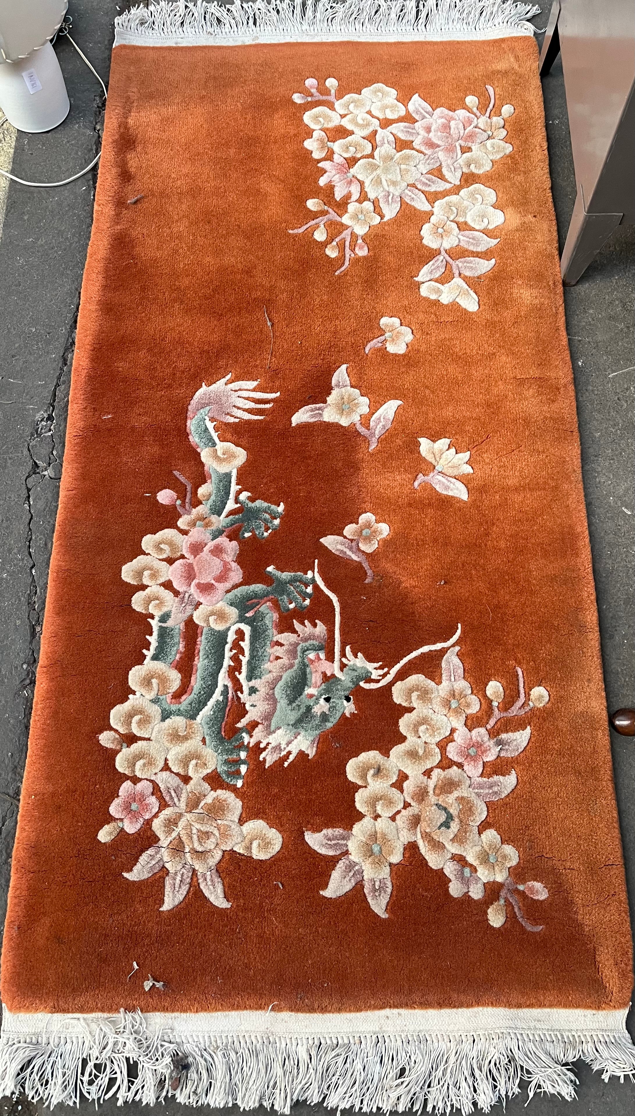 Chinese wool rug depicting a dragon design