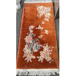 Chinese wool rug depicting a dragon design