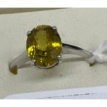 10ct white gold ladies ring set with a large yellow cut stone. [Ring size R] [2.46Grams]