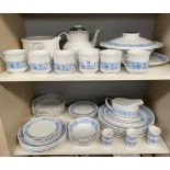 Two shelves of Royal Doulton 'Cranbourne' dinner and tea service. Includes tureens and platters.