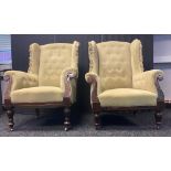 Pair of his and hers gullwing arm chairs with button back in sage green colour