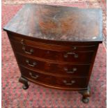 Bow front three drawer chest with pull out writing area.