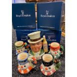 A Collection of Royal doulton Snowman Toby jugs in different colouration s together with Royal