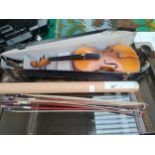 Antique violin together with 4 violin bows