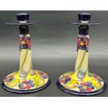 A Pair of Moorcroft candlesticks 'The Dames, Pansy Pattern' Designer Kerry Goodwin, [Dated 2010] [
