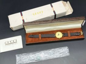 Vintage Gucci Quartz gold plated wrist watch, comes with boxes and booklet.