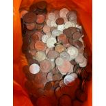 Four bags containing Six Pence, Half Crowns, Crowns and mixed world coins.