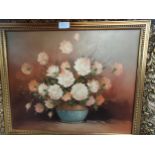 Oil painting depicting flowers in vase signed signed Robert cox in fitted gilt framing .