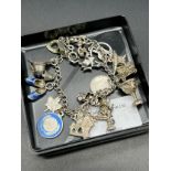 Sterling Silver charm bracelet and various silver charms to include silver and enamel charms.