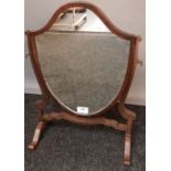Victorian tabletop shield design mirror, raised on trestle bases [52cm high]