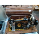 Serata hand crank sewing machine, body is designed with gold trims and lions
