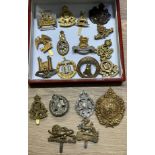 A Collection of military cap badges to include Argyll & Sutherland, Loyal Suffolk Hussars, Union