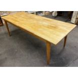 A Large contemporary farm house light wood dining table
