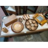 Selection of treen ware to include wall barometer with brushes attached.