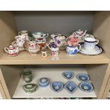 Shelf of Wedgwood jasper ware dishes. Together with a shelf of trio's and small porcelain tea