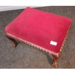 Antique stool, the red upholstered cushioned seat raised on cabriole legs ending in claw and ball