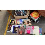 Box of records and pile of records mixed genres. Includes Winston Churchill his memoirs and his