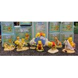 A Large Collection of Royal doulton wini the pooh figures includes wini the Pooh clock,