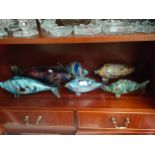 A Shelf of 6 various art glass fish sculptures