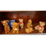 A Shelf of vintage porcelain teddy banks and Garfield cat bank