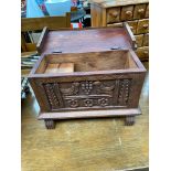 A Small carved pine storage chest, detailed with birds, grapes and floral design front panel.