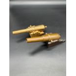 Antique brass miniature firing canon with markings to the top- comes with a wooden base. Together