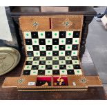Inlaid chess board, with sliding compartments to reveal the chess pieces.