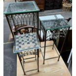 Three metal and glass top side tables.