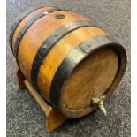 Antique oak and metal bound whisky barrel, pourer and stand. [40x42x35cm]