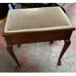 Lift top piano stool supported on queen anne legs