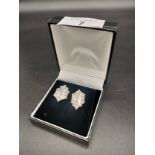 A Pair of White gold [possibly Platinum] items of jewellery containing diamond stone settings.