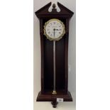 T.W. Bazeley Clockmaker Cheltenham England rise and fall wall clock. Mahogany casing, Gilt brass