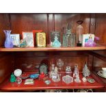 Two shelves of art glass and crystal perfume bottles and other items to include cut glass art deco