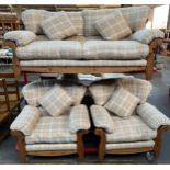 A Pine Ducal three piece sofa set. Cream tartan design material upholstery cushions.