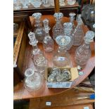 A Selection of antique crystal decanters and various loose stoppers. Also includes Four T. Goode &