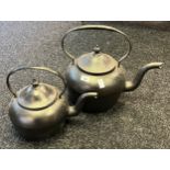 Two large antique cast iron tea pots- largest- 18 pints [36cm high]