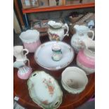 A Collection of antique water jugs and large porcelain basin