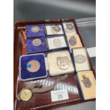 A Selection of silver marked and bronze fob medals/ badges. Some have boxes. Together with silver