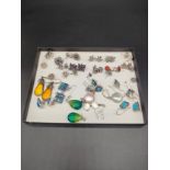 A Collection of silver earrings, includes silver and enamel earrings, amber, opal and pearl